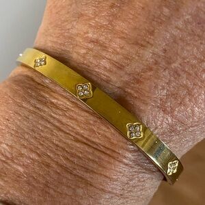 Gold Tone Hinged Bangle Bracelet with Crystal Accents |
